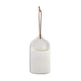 semicylinder shaped white ceramic crock with leather string hook