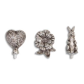 three silver knobs designed to be a heart, a flower and a rabbit