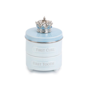 Small white jar with 'first curl' and 'first tooth' carved in - top of jar is light blue with a silver crown on top