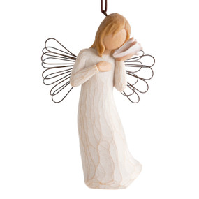 Female angel with wire wings in cream dress, holding pink shell up to ear, ornament loop attached to head
