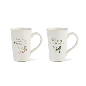 white tall mugs with Christmas phrases printed on them