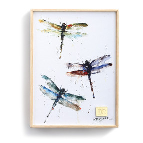 light wooden frame around watercolor painting of three multicolored dragonflies on white background