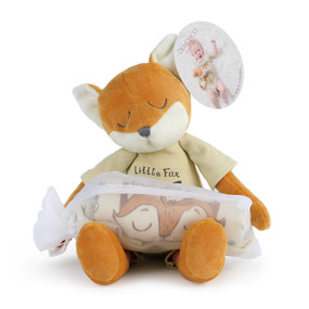 stuffed animal fox with tan onesie rolled up inside drawstring bag on lap and tag reading Fits Most 6 to 9 Months