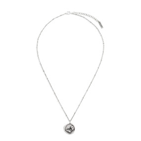 A dainty silver necklace with several silver knots on the chain, and a circular pendant with a butterfly.