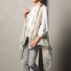 A lime green and pink floral print  Rectangle Scarf placed on an ivory and black mannequin.