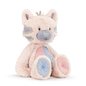 A large pink plush Oddball" kitty with purple, gray, and blue polka dotted accents."