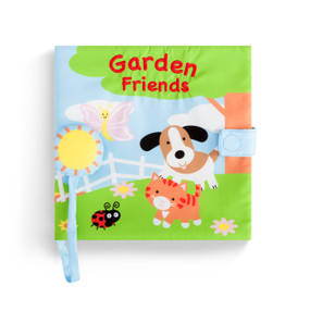 The front cover of a soft activity sound book, Friends in the Garden". Front cover is four animals, a dog, a cat, a ladybug, and a butterfly, standing in a field."