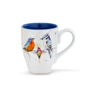 A white ceramic coffee mug with several watercolor painted birds around the outside, and a dark blue inner lining.