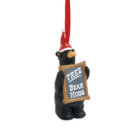 Black bear figurine ornament holding sign that says 'free bear hugs' - string is red