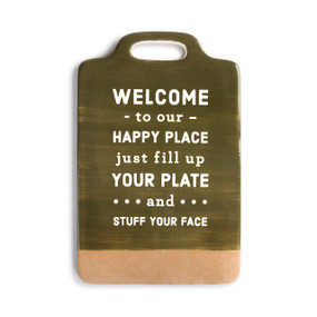 A green and tan serving board with "Welcome to our happy place just fill up your plate and stuff your face" in white typography.