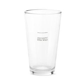 A clear pint glass that says "Where America is Still Wild" under two black lines with room for personalization.