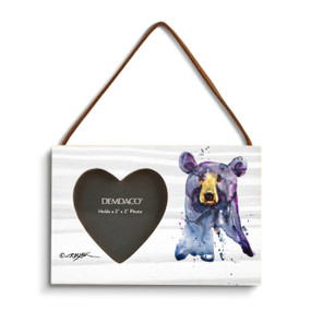 A rectangular wood hanging frame with a heart shaped 2 inch photo opening next to a watercolor image of a black bear face.