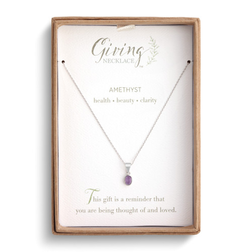 amethyst necklace in packaging box with card that explains qualities of amethyst and gift-giving sentiment