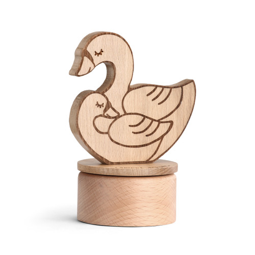 round wooden box with cutout of swan mother and baby stood up vertically on lid