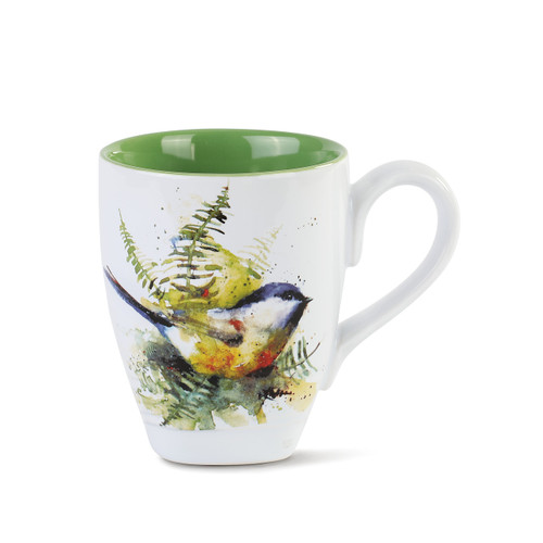 white mug painted green inside with painted bird on outside