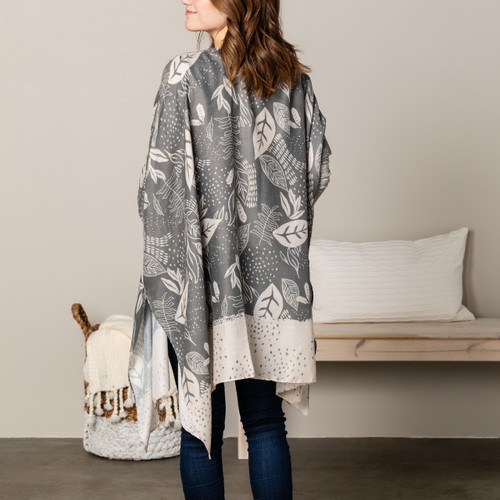 back of woman wearing gray and white with leaf pattern kimono