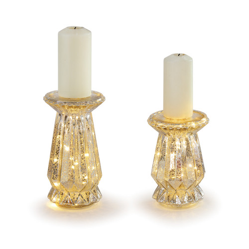 gold candle holders with lights inside