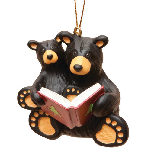 Larger black bear figurine ornament holding smaller black bear reading a book