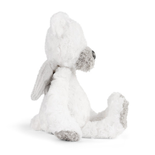 side view of fluffy white stuffed bear with angel wings