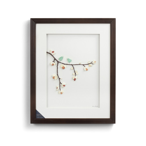 Dark brown wooden outline frame with white center and tree branch pebble figurine centered