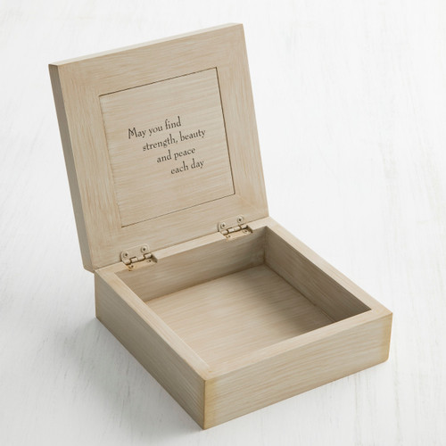 Open cream wooden box with 'may you find strength, beauty, and peace each day' in black