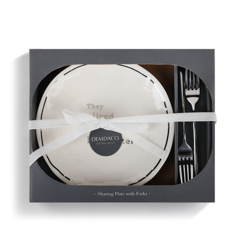 white ceramic plate with two forks contained in cardboard box