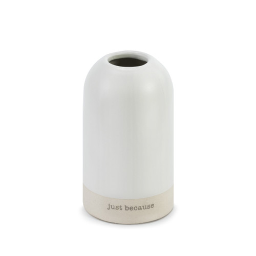 A small white cylinder vase with "Just Because" engraved.