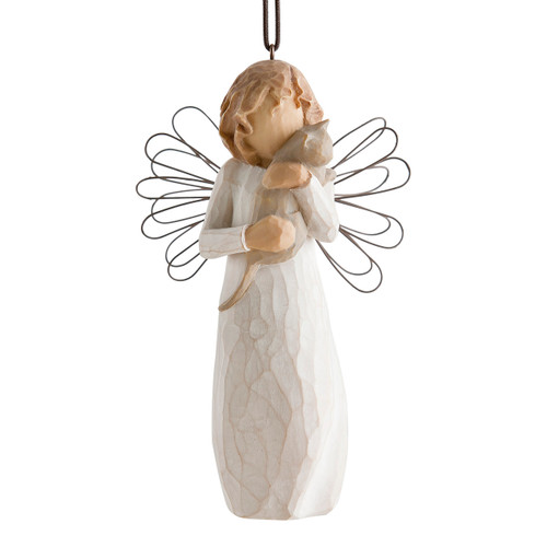 Figure in cream dress with wire wings, holding gray cat in arms, ornament loop attached to head