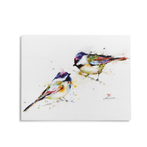 Square white wall art with image of two multi-color hummingbirds on it