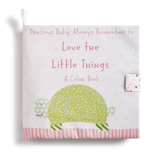 White bag with 'Precious baby, always remember to love the little things - a color book' in light pink letters above a green turtle print