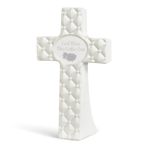 White cross figurine with 'god bless this little one' in grey on the center of it