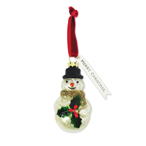 White snowman ornament with black top hat, green holly, hung by red string