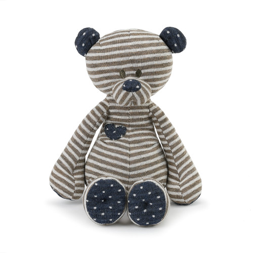 tan stuffed bear with striped body and polka dot nose and ears