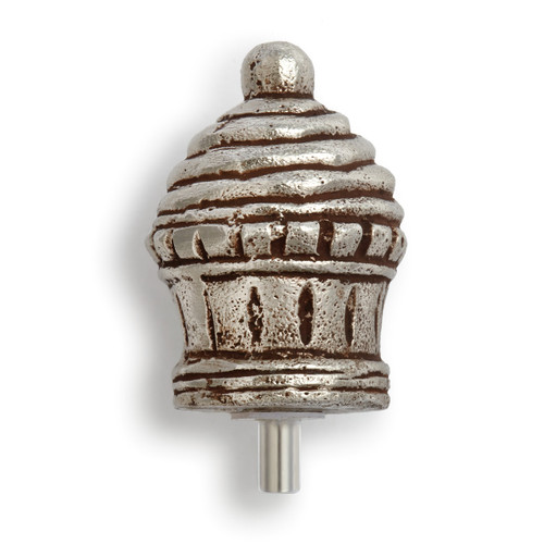 Back view. Aluminum cupcake-shaped token has some rust-like coloring in its creases. Cupcake token has wrapper on bottom, icing swirl, and a round topping on top