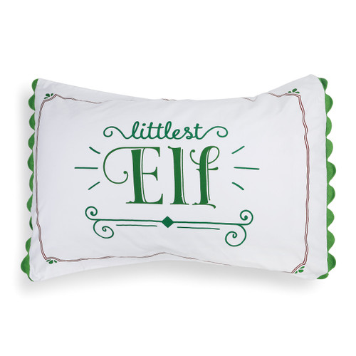 white pillow with green detailing reading Littlest Elf
