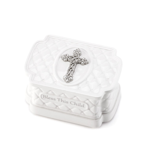 Small white keepsake box with silver cross on it and 'bless this child' carved in grey