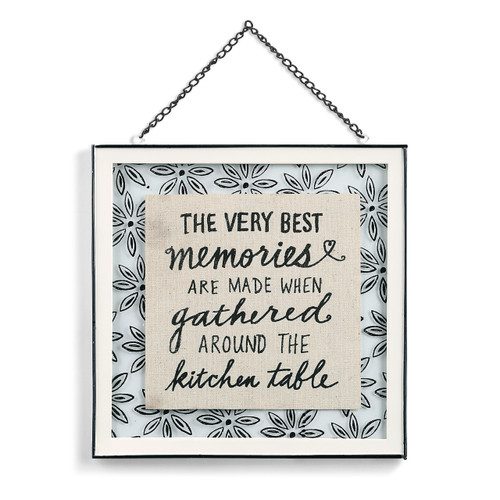 glass wall hanging with metal frame reading The Very Best Memories are made when Gathered around the Kitchen Table