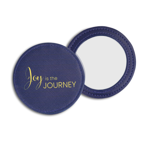 both sides of a purple compact mirror with the back side reading Joy is the Journey in gold letters