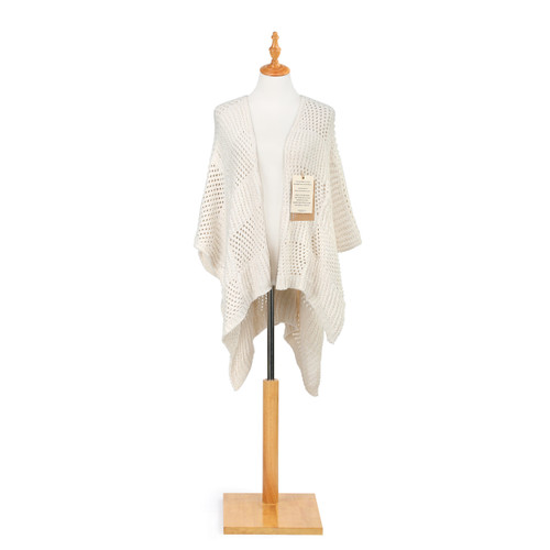 white loose knit cardigan with drapey sleeves and hem that reaches past hips with product label attached