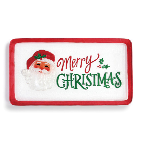 rectangular glass plate with red border an Santa head reading Merry Christmas