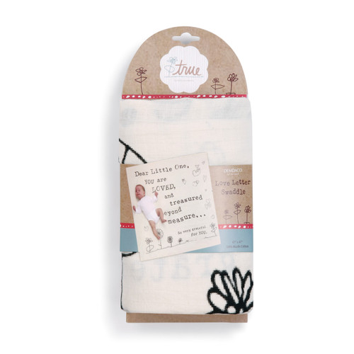 White/tan tag holding a love letter swaddle in whtie with 'dear little one you are loved and treasured beyond measure...' on square banner