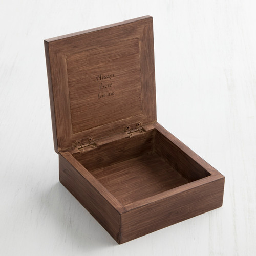 Open wooden box with 'always there for me' carved in