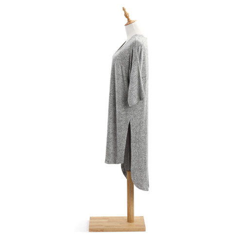 Side view of light grey shawl on wooden mannequin stand