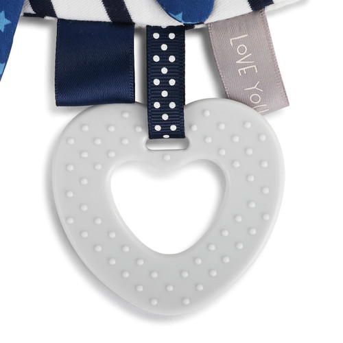 black with white polka dots ribbon loop holding gray rubber heart with bumps on it