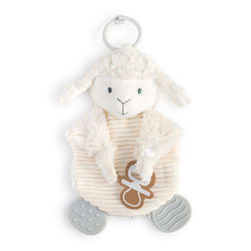 A soft, plush, bright white and cream Lamb Teething Buddy with two gray textured tabs and a light gray ring. The two arms are folded onto the stomach, one holding a cardboard tag with a white outline of a pacifier.