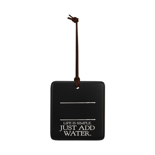 A square black hanging ornament that says "Life is Simple. Just Add Water." in white under two white lines with room for personalization.