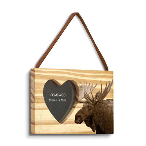 A rectangular wood hanging ornament with a heart shaped 2 inch photo opening next to an image of a moose, displayed angled to the right.