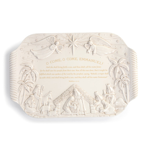 white dish with carved out nativity scene and bible verse printed in gold on front