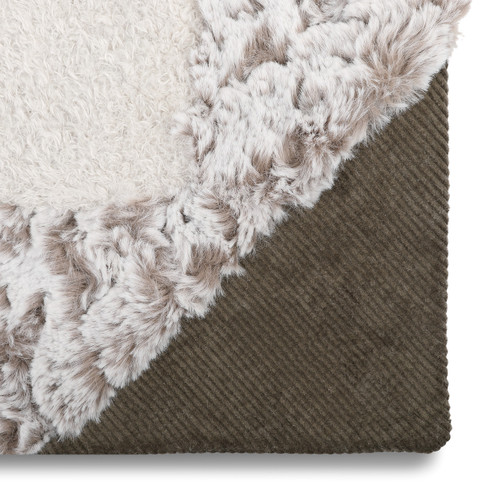detail shot of blanket corner showing three different fabrics