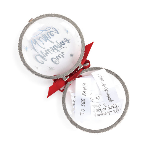 glass ball ornament open like a locket with papers inside
